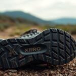 Close-up view of the sole of a Xero Shoes sneaker resting on a rocky dirt path, highlighting the tread pattern and XERO branding.